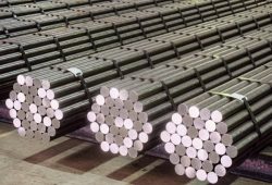 Round steel section rolling profile in stacked. Warehouse of metal products. Round steel section rolling profile in stacked. Warehouse of metal products.